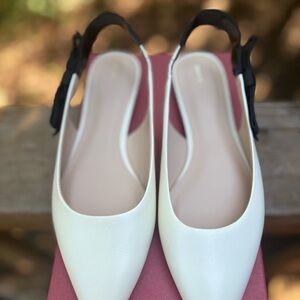 Maeve Cream Pointed-Toe Slingback Flats with Black Bow Strap
